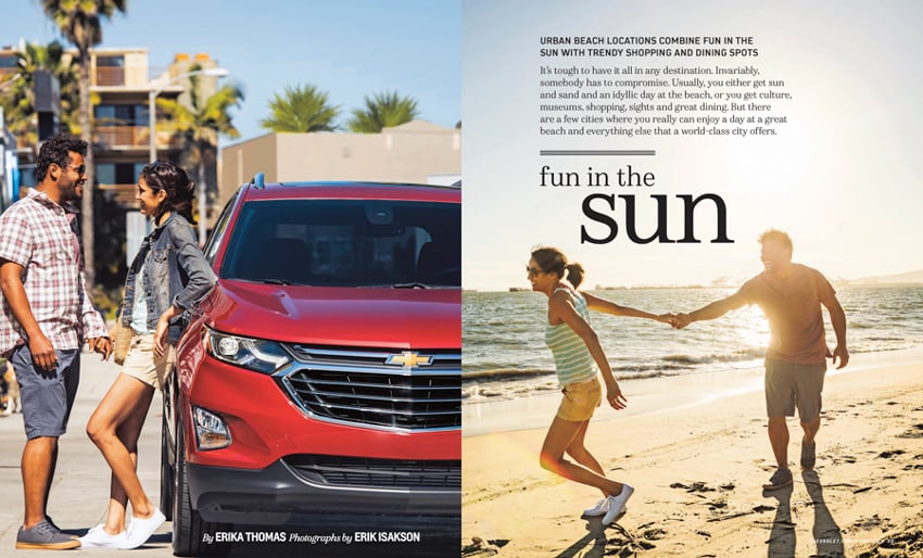 A tear sheet by photographer Erik Isakson for Chevrolet's New Roads Magazine featuring a photo of a red Chevrolet SUV and a man and woman holding hands while the woman leans against it. There is a second photo of a man and woman on a beach in bright sunshine. The woman is pulling the man by the hand, and they appear to be running.
